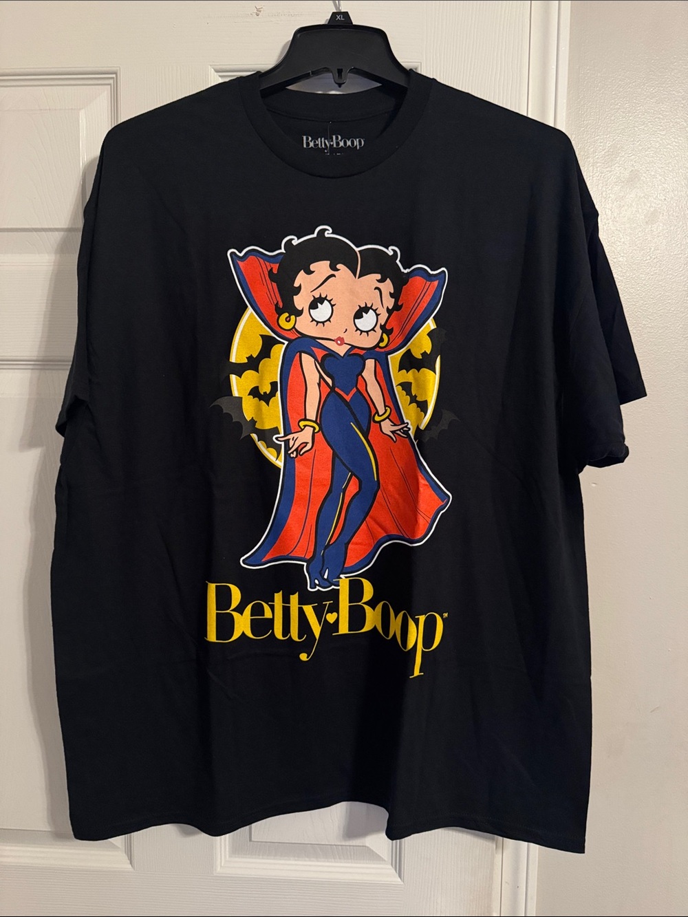 Betty Boop Black Tee with Red Cape and Yellow Logo